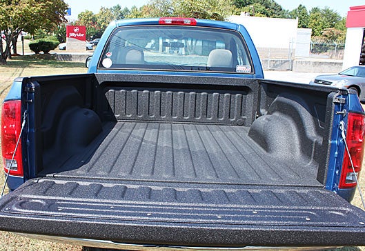 Blue truck with Bullet spray on truck bed liner
